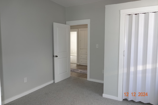 unfurnished bedroom with carpet floors