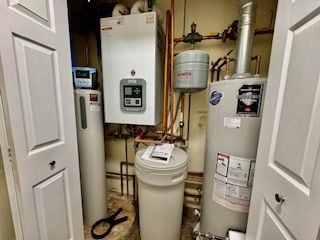 utility room featuring water heater