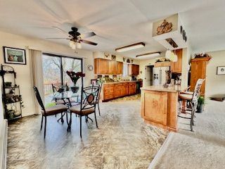 dining room featuring ceiling fan