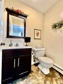 bathroom featuring vanity, a baseboard radiator, and toilet