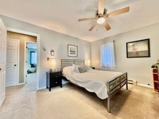 bedroom featuring ceiling fan and carpet