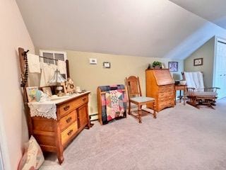 sitting room featuring light colored carpet and vaulted ceiling