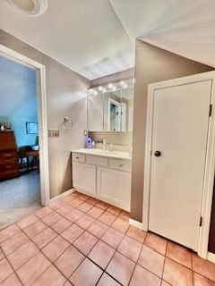 bathroom featuring tile patterned flooring and vanity