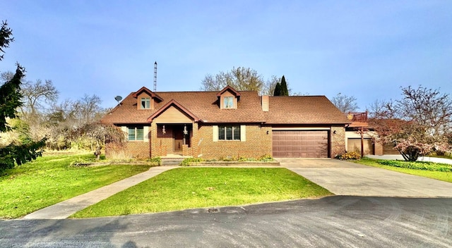 view of front of property with a garage and a front lawn