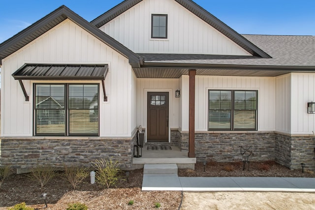 12711 Ivy Ln, Linden, MI 48451 - view of exterior entry with stone siding and roof with shingles