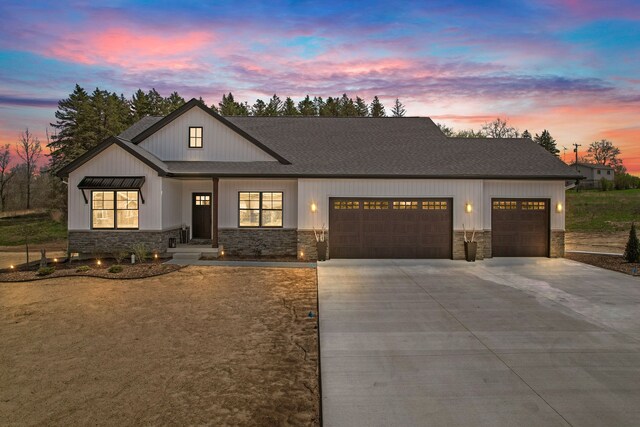 12711 Ivy Ln, Linden, MI 48451 - modern inspired farmhouse with a garage, stone siding, concrete driveway, and a shingled roof