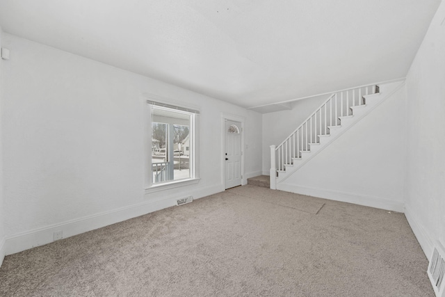 view of carpeted entrance foyer