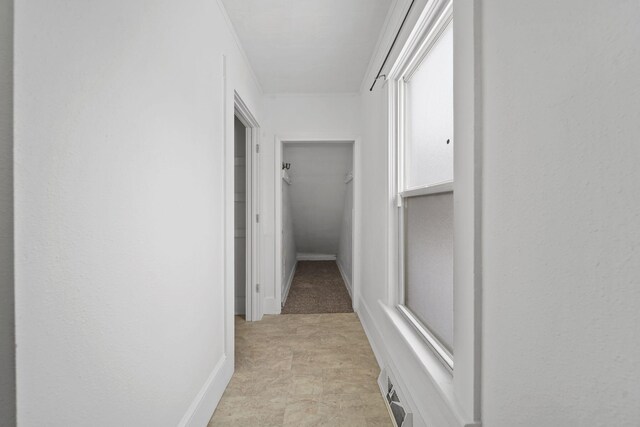 corridor with crown molding