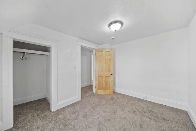 unfurnished bedroom featuring a closet and carpet