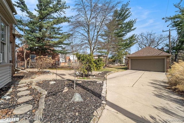 view of yard with a garage and an outdoor structure