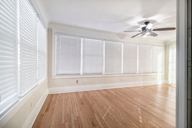 spare room with light hardwood / wood-style floors and ceiling fan