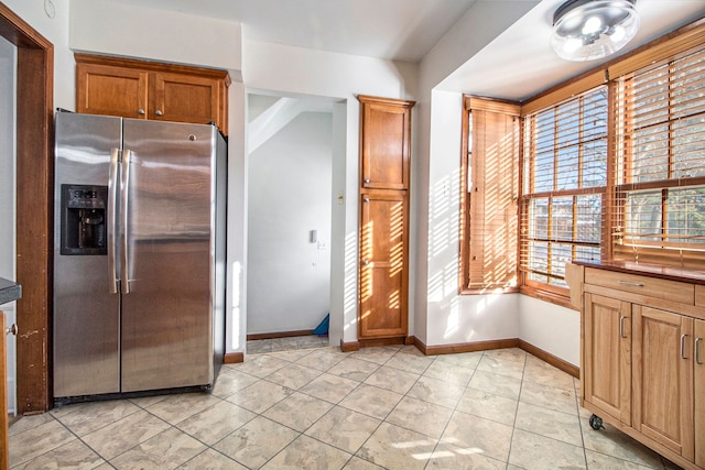 kitchen with stainless steel refrigerator with ice dispenser