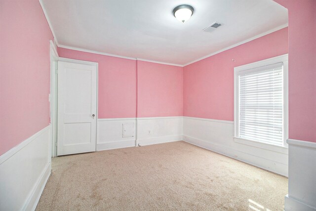 carpeted empty room with crown molding