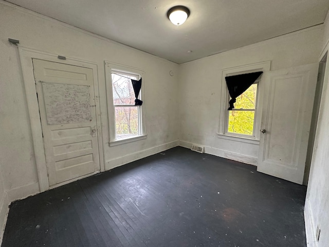 empty room featuring dark hardwood / wood-style flooring