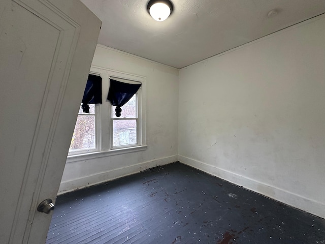 unfurnished room with dark hardwood / wood-style flooring