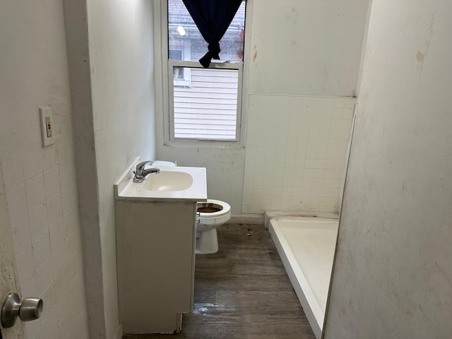 bathroom with hardwood / wood-style floors, vanity, toilet, and plenty of natural light