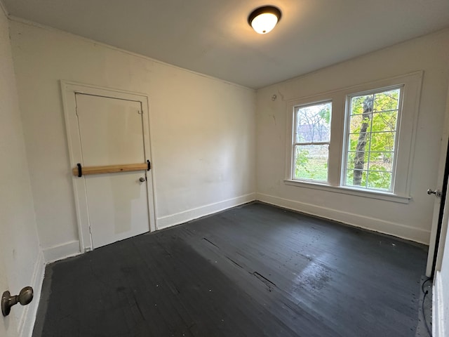 spare room featuring dark hardwood / wood-style floors