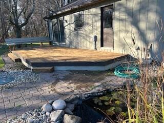 view of home's exterior featuring a wooden deck