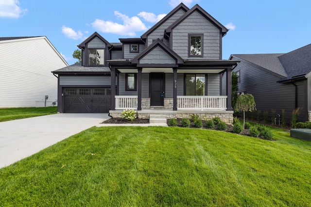 craftsman house featuring a porch, a garage, and a front yard