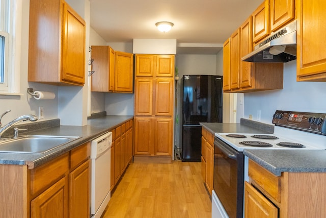 kitchen with sink, electric range, black refrigerator, dishwasher, and light hardwood / wood-style floors