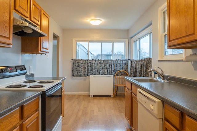 kitchen featuring range with electric cooktop, sink, white dishwasher, and light hardwood / wood-style flooring