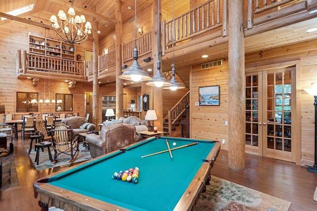 rec room featuring french doors, high vaulted ceiling, billiards, wood walls, and wood-type flooring