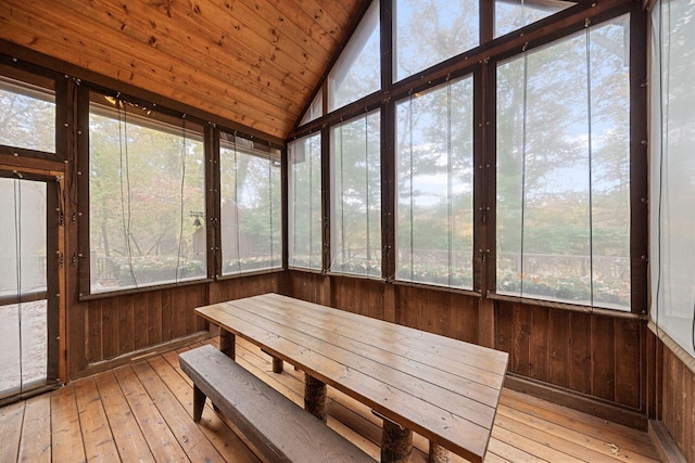 unfurnished sunroom with vaulted ceiling and wooden ceiling