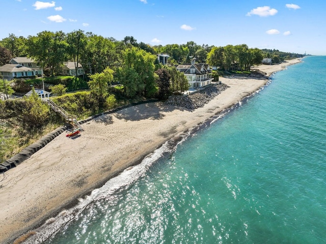 aerial view with a water view and a view of the beach