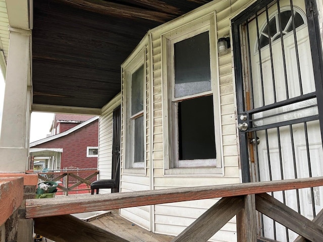 view of side of property with covered porch