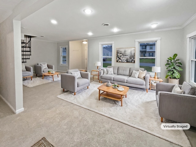 carpeted living room featuring plenty of natural light and crown molding