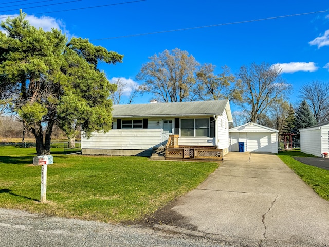 ranch-style house with an outbuilding, a front lawn, and a garage