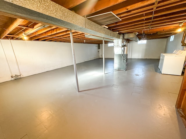 basement with independent washer and dryer and heating unit