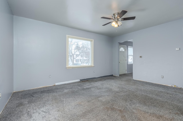 empty room with carpet flooring and ceiling fan