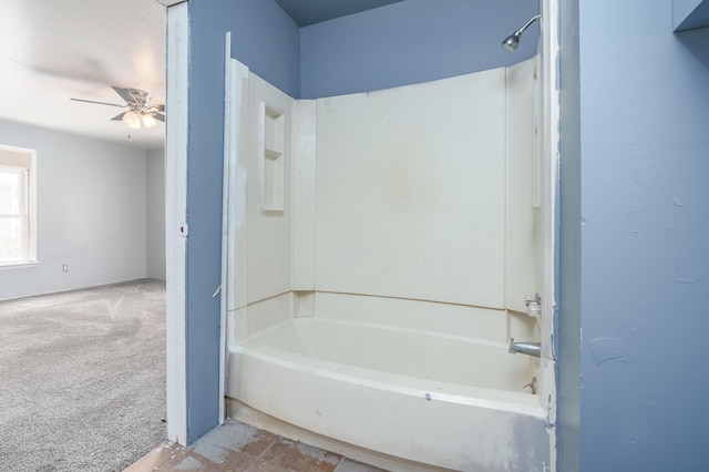 bathroom with ceiling fan and shower / washtub combination