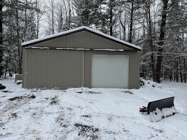 view of snow covered garage