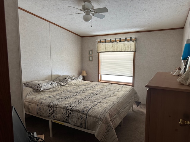 carpeted bedroom featuring a textured ceiling, ceiling fan, and crown molding