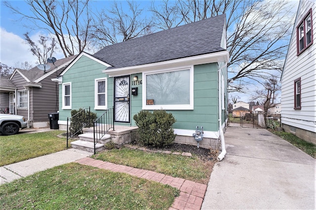 bungalow-style house with a front yard