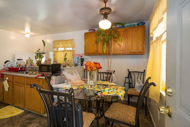 dining room with dark hardwood / wood-style flooring and sink