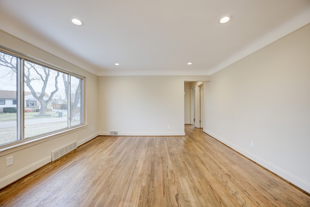 spare room featuring light hardwood / wood-style floors