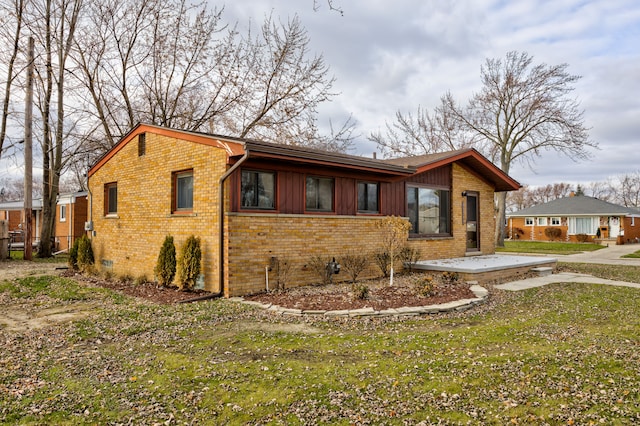 view of property exterior featuring a lawn