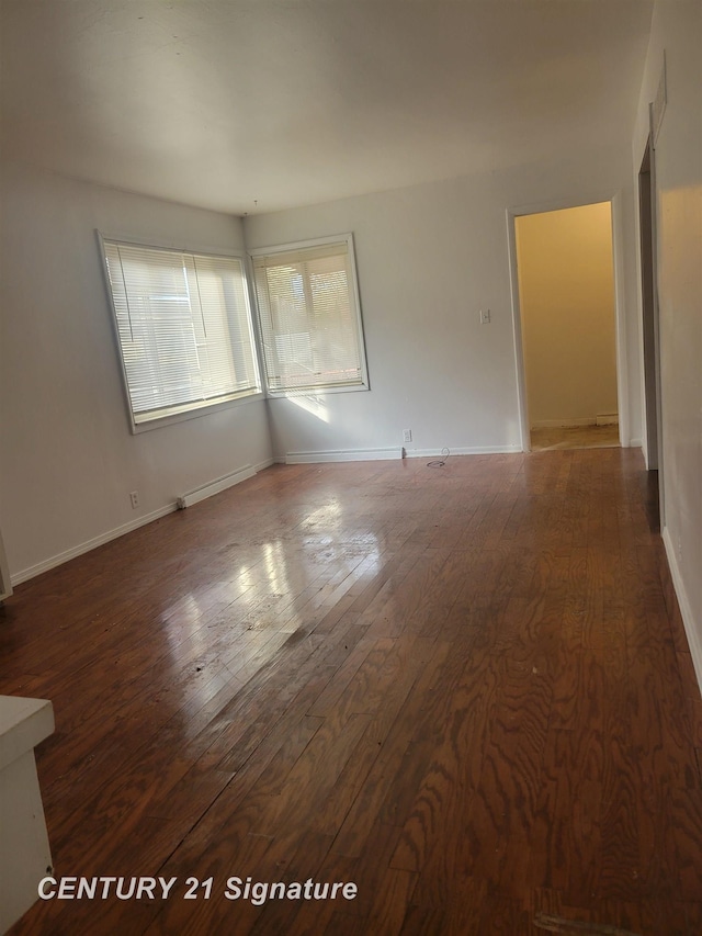 empty room featuring dark hardwood / wood-style floors