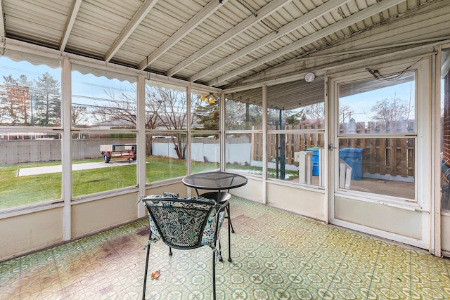 sunroom featuring lofted ceiling with beams and wood ceiling