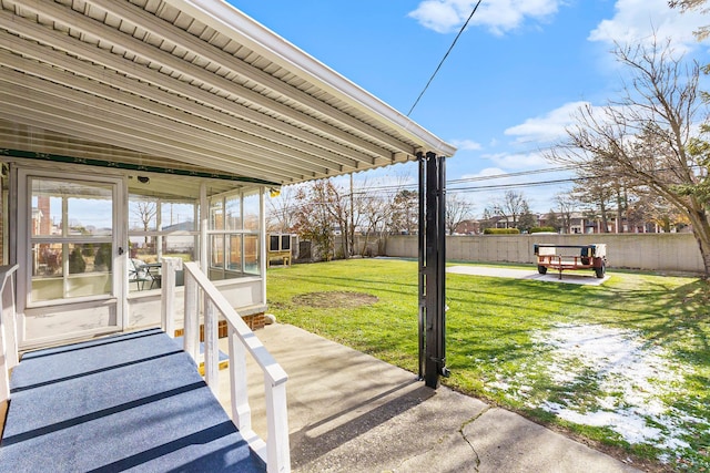 view of yard featuring a patio area and a sunroom