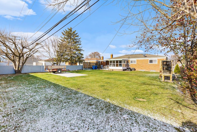 view of yard with a patio area and a sunroom