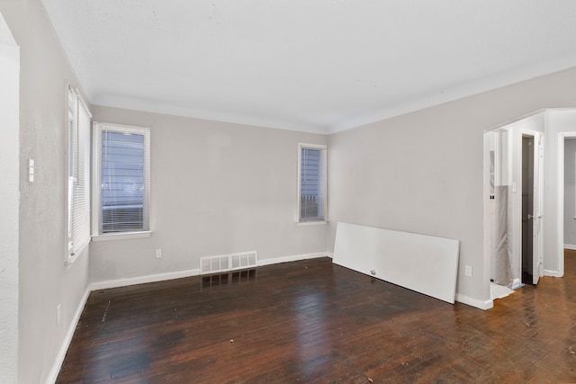 empty room featuring dark hardwood / wood-style flooring