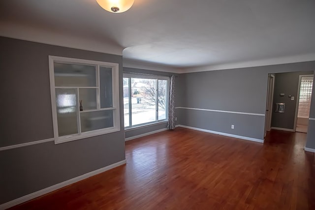 empty room featuring dark hardwood / wood-style flooring