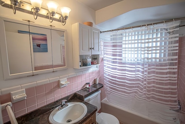 full bathroom featuring tasteful backsplash, vanity, toilet, and shower / bath combo with shower curtain