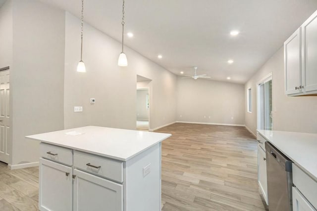 kitchen featuring white cabinets, dishwasher, and light hardwood / wood-style flooring