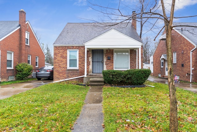 bungalow-style home featuring a front yard