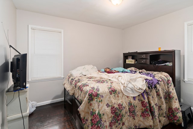 bedroom featuring dark hardwood / wood-style floors